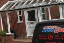 Advanced Autoglazing van outside home with new tinted windows